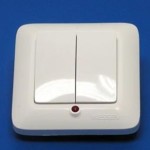 Белый пластиковый выключатель для прихожей с красной подсветкой