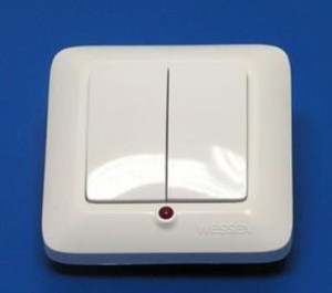 Белый пластиковый выключатель для прихожей с красной подсветкой